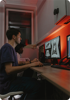 Radiology and imaging support â€” radiologist reviewing scans